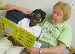 Home Volunteer - Older lady reading with child